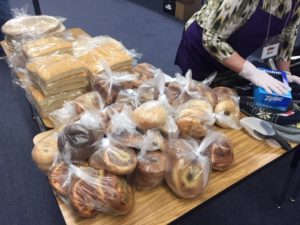 bagels and bread being prepared to serve hungry kids in denver